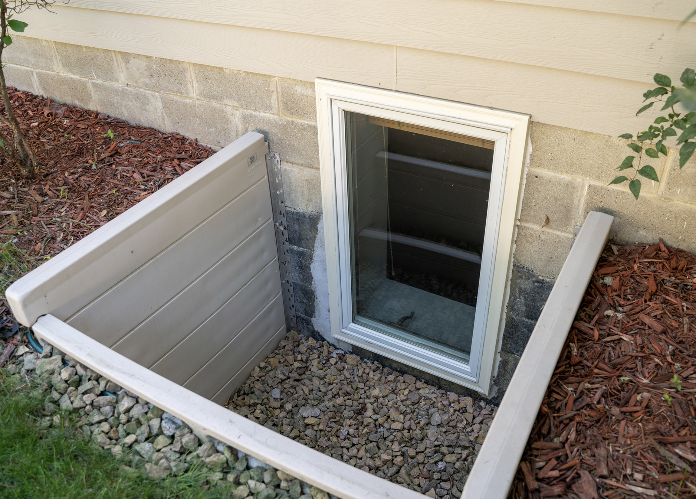 Egress window with window well installed in foundation